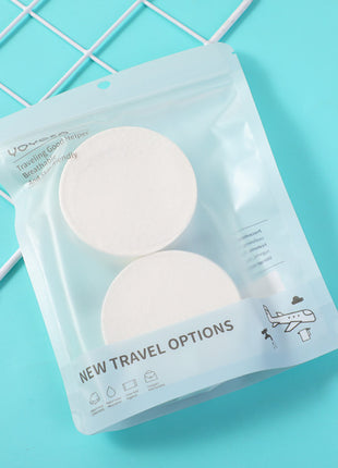 2 compressed bath towels (round).