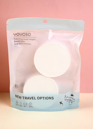 2 compressed bath towels (round).