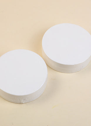 2 compressed bath towels (round).