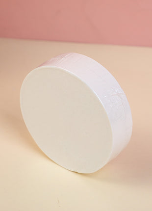 2 compressed bath towels (round).